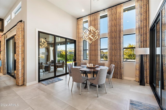 dining area featuring a high ceiling