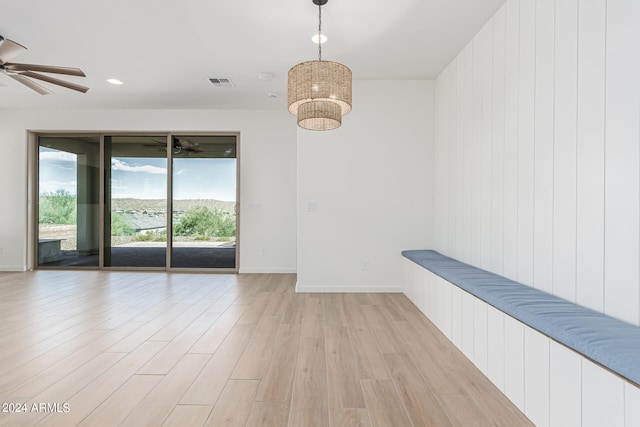 empty room featuring ceiling fan and light hardwood / wood-style flooring