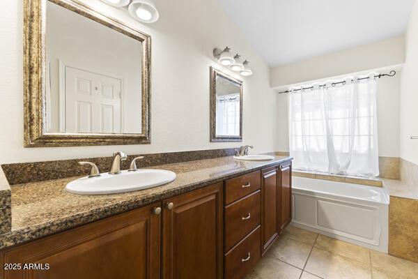 5450 E Paradise Ln, Scottsdale, AZ 85254 - bathroom featuring tile patterned floors, double vanity, and a garden tub