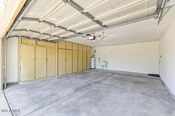 5450 E Paradise Ln, Scottsdale, AZ 85254 - garage featuring water heater and a garage door opener