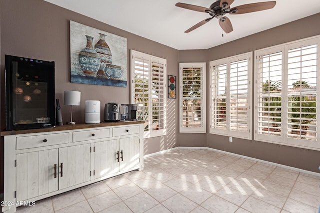 interior space featuring plenty of natural light, ceiling fan, and light tile patterned floors