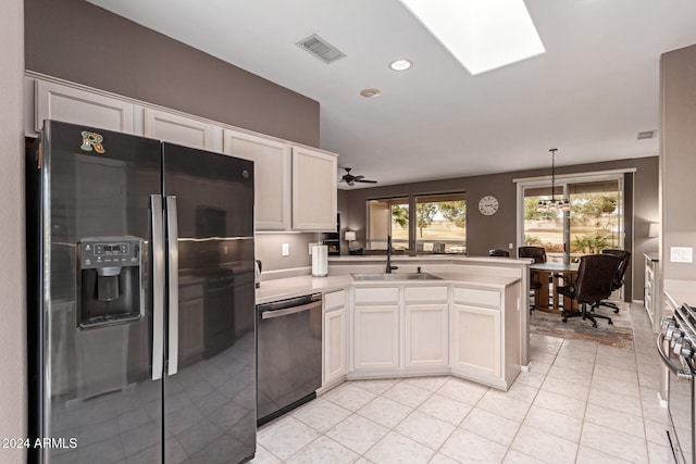 kitchen with ceiling fan, sink, stainless steel appliances, pendant lighting, and white cabinets