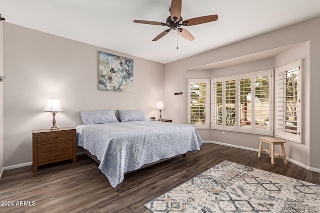 bedroom featuring ceiling fan and dark hardwood / wood-style floors