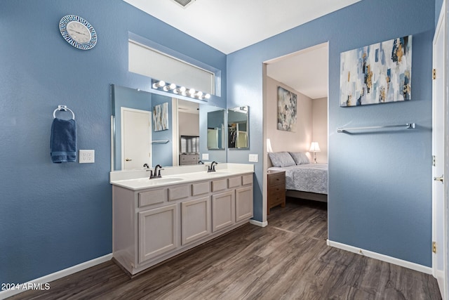 bathroom featuring hardwood / wood-style floors and vanity