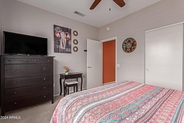 bedroom with light carpet and ceiling fan