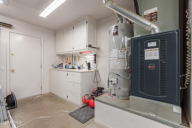 utility room featuring gas water heater