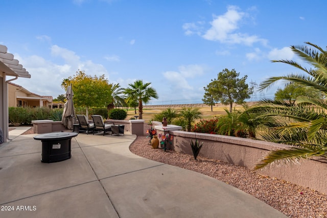 view of patio with an outdoor fire pit