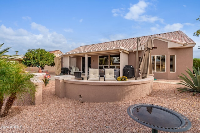 rear view of property with a patio area