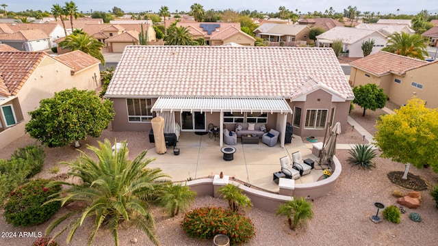 exterior space featuring a patio area and an outdoor hangout area