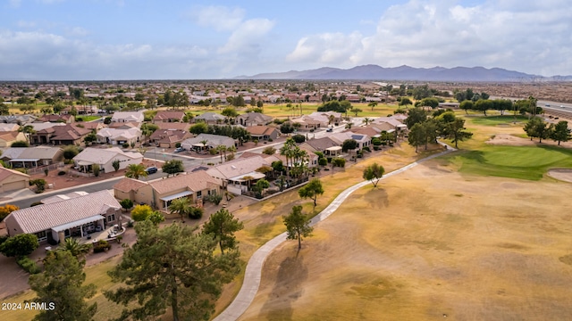 birds eye view of property with a mountain view