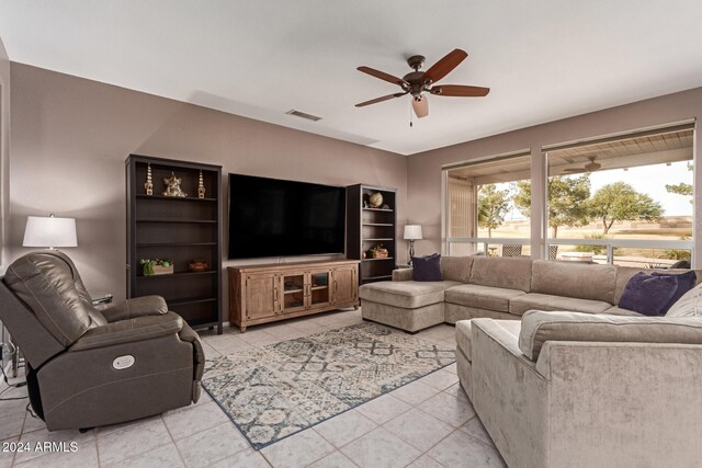 tiled living room featuring ceiling fan