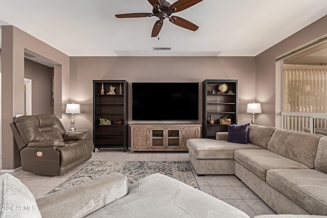 tiled living room with ceiling fan