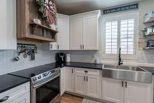 12238 W Patrick Ct, Sun City, AZ 85373 - kitchen with open shelves, stainless steel range with electric cooktop, a sink, and white cabinets