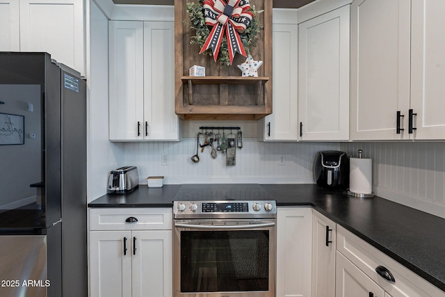 12238 W Patrick Ct, Sun City, AZ 85373 - kitchen featuring stainless steel appliances, dark countertops, white cabinets, and open shelves