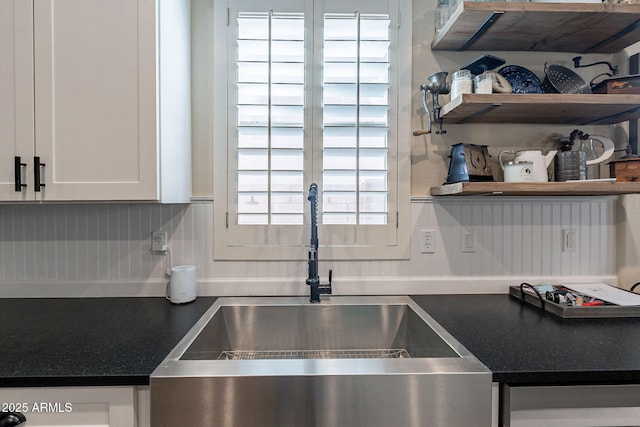 12238 W Patrick Ct, Sun City, AZ 85373 - kitchen with a sink, white cabinets, dark countertops, and open shelves