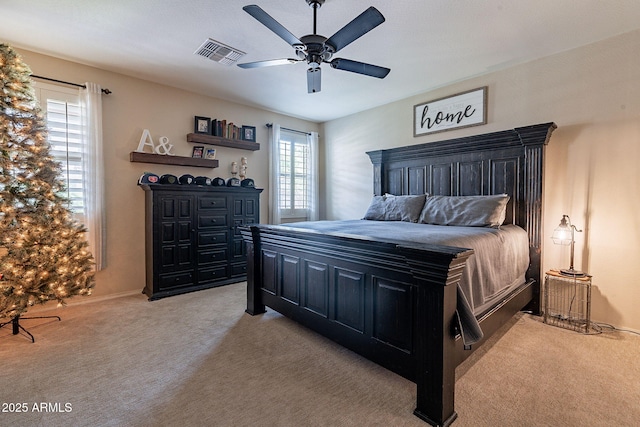 12238 W Patrick Ct, Sun City, AZ 85373 - bedroom with light colored carpet, ceiling fan, and baseboards