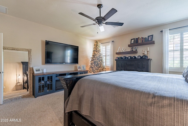 12238 W Patrick Ct, Sun City, AZ 85373 - bedroom with light colored carpet and a ceiling fan