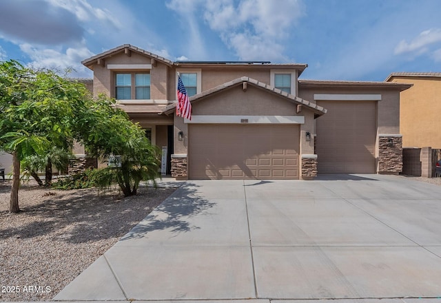 12238 W Patrick Ct, Sun City, AZ 85373 - view of front of house with stone siding, an attached garage, concrete driveway, and stucco siding