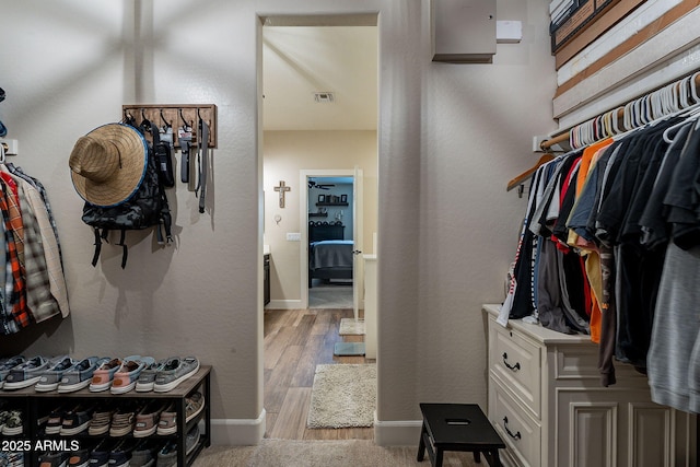12238 W Patrick Ct, Sun City, AZ 85373 - spacious closet featuring wood finished floors