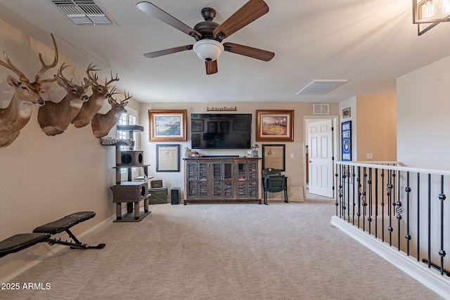 12238 W Patrick Ct, Sun City, AZ 85373 - carpeted living area with a ceiling fan and baseboards