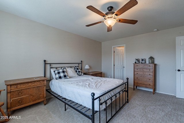 12238 W Patrick Ct, Sun City, AZ 85373 - bedroom featuring light carpet, a ceiling fan, and baseboards