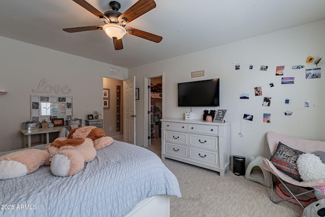 12238 W Patrick Ct, Sun City, AZ 85373 - bedroom with a spacious closet, light carpet, a closet, and ceiling fan