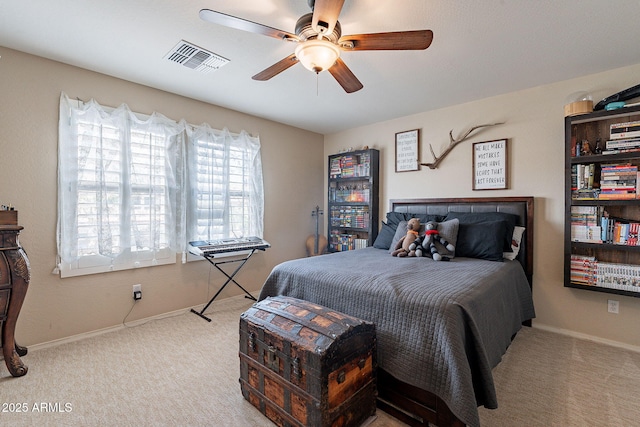 12238 W Patrick Ct, Sun City, AZ 85373 - bedroom featuring carpet, baseboards, and a ceiling fan
