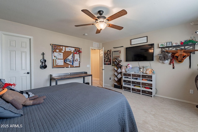 12238 W Patrick Ct, Sun City, AZ 85373 - bedroom with baseboards, light colored carpet, and a ceiling fan