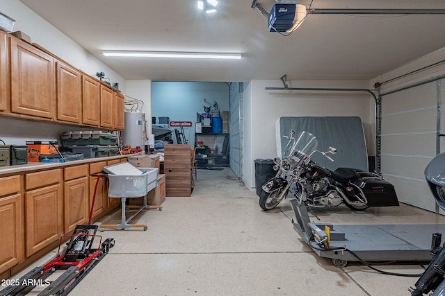 12238 W Patrick Ct, Sun City, AZ 85373 - garage with gas water heater and a garage door opener