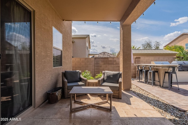 12238 W Patrick Ct, Sun City, AZ 85373 - view of patio featuring fence and grilling area