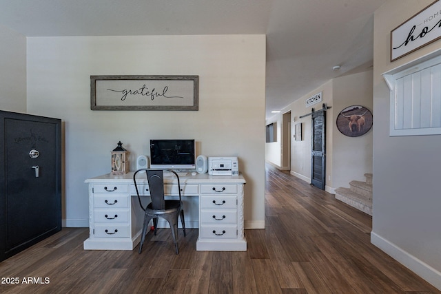 12238 W Patrick Ct, Sun City, AZ 85373 - office space featuring a barn door, dark wood-type flooring, and baseboards