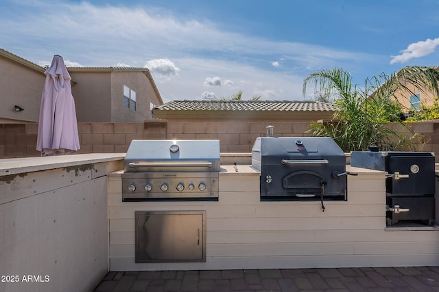 12238 W Patrick Ct, Sun City, AZ 85373 - view of patio with grilling area, area for grilling, and fence