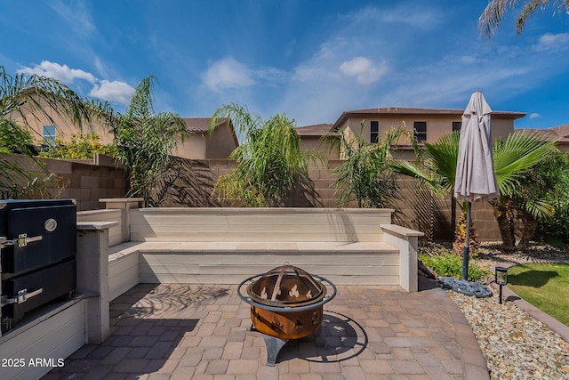 12238 W Patrick Ct, Sun City, AZ 85373 - view of patio featuring an outdoor fire pit and fence