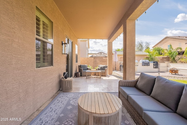 12238 W Patrick Ct, Sun City, AZ 85373 - view of patio / terrace featuring an outdoor hangout area, fence, and an outdoor kitchen