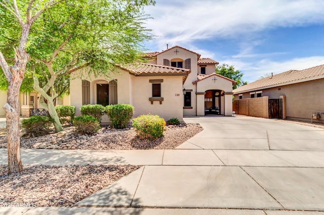 3029 E Patrick St, Gilbert, AZ 85295 - mediterranean / spanish house with stucco siding, a tiled roof, and a gate