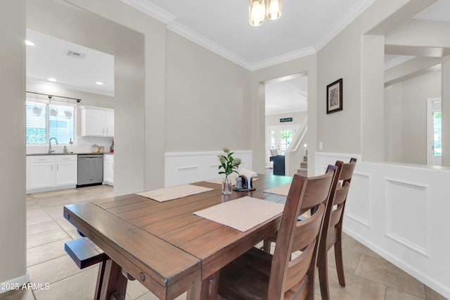 3029 E Patrick St, Gilbert, AZ 85295 - dining area with light tile patterned floors, a decorative wall, a wainscoted wall, ornamental molding, and stairway
