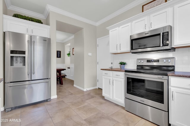3029 E Patrick St, Gilbert, AZ 85295 - kitchen with appliances with stainless steel finishes, crown molding, decorative backsplash, and white cabinetry