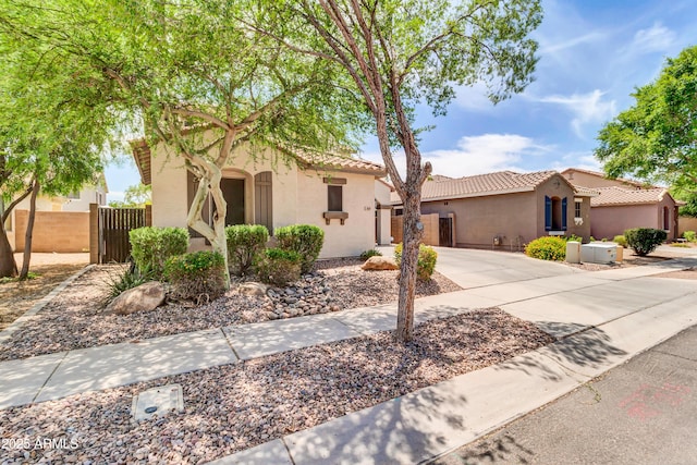 3029 E Patrick St, Gilbert, AZ 85295 - mediterranean / spanish home with stucco siding, a tiled roof, a gate, and concrete driveway
