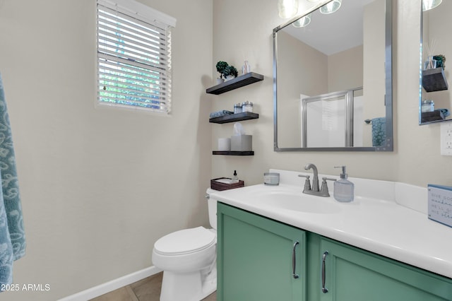 3029 E Patrick St, Gilbert, AZ 85295 - bathroom with vanity, a stall shower, toilet, tile patterned flooring, and baseboards