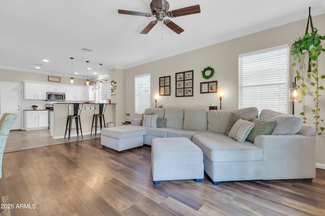 3029 E Patrick St, Gilbert, AZ 85295 - living area featuring ceiling fan, wood finished floors, crown molding, recessed lighting, and baseboards