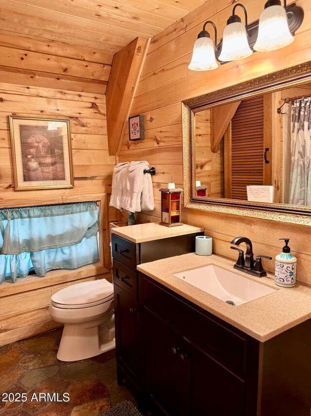403 W Sherwood Dr, Payson, AZ 85541 - full bathroom with wood walls, toilet, vanity, wood ceiling, and stone tile floors