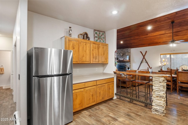 6523 Wild Cat Way, Pinetop, AZ 85935 - kitchen with freestanding refrigerator, ceiling fan, light wood-style flooring, light countertops, and recessed lighting
