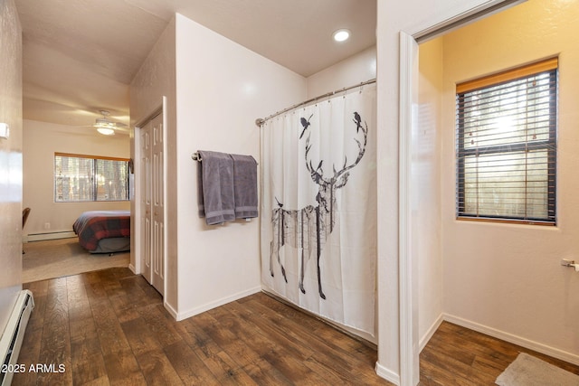 6523 Wild Cat Way, Pinetop, AZ 85935 - ensuite bathroom featuring baseboard heating, a baseboard heating unit, wood-type flooring, and ceiling fan