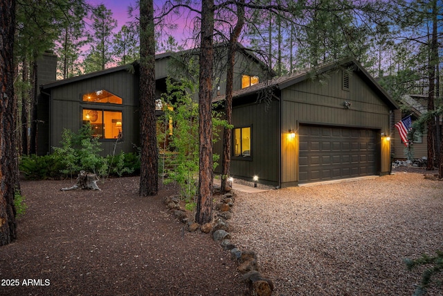 6523 Wild Cat Way, Pinetop, AZ 85935 - view of front facade featuring a chimney, gravel driveway, and a garage