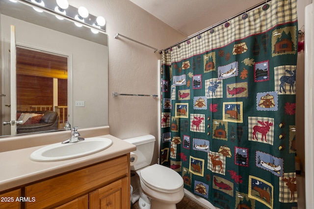 6523 Wild Cat Way, Pinetop, AZ 85935 - full bath with a textured wall, vanity, toilet, and a shower with curtain