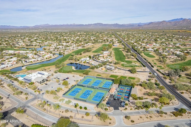 drone / aerial view with a water and mountain view