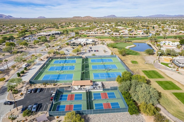 drone / aerial view with a water and mountain view