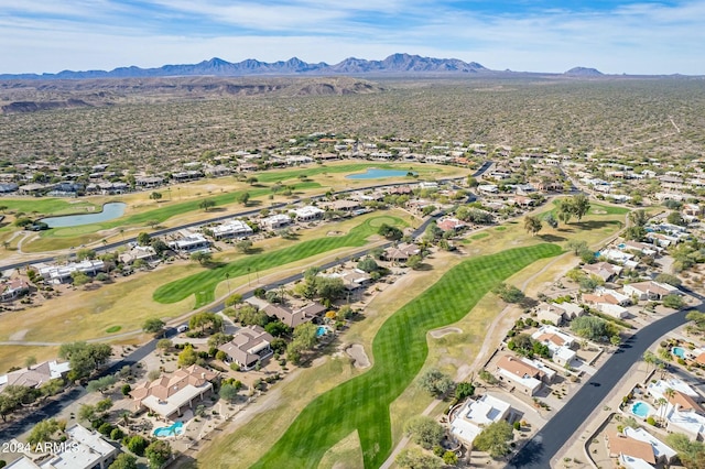 drone / aerial view with a water and mountain view