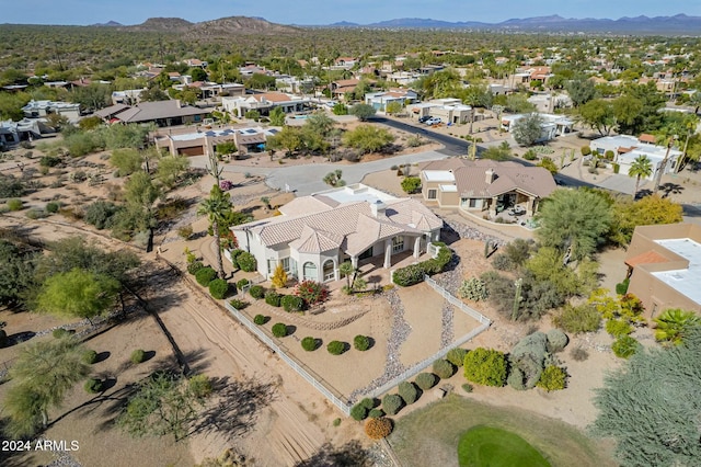 birds eye view of property with a mountain view