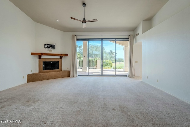 unfurnished living room with carpet floors and ceiling fan